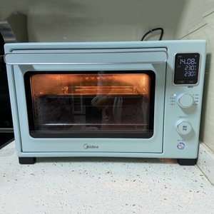 美的家用烤箱蒸汽补湿烤蛋糕烘焙专用石墨烯免预热搪瓷电烤箱Q30